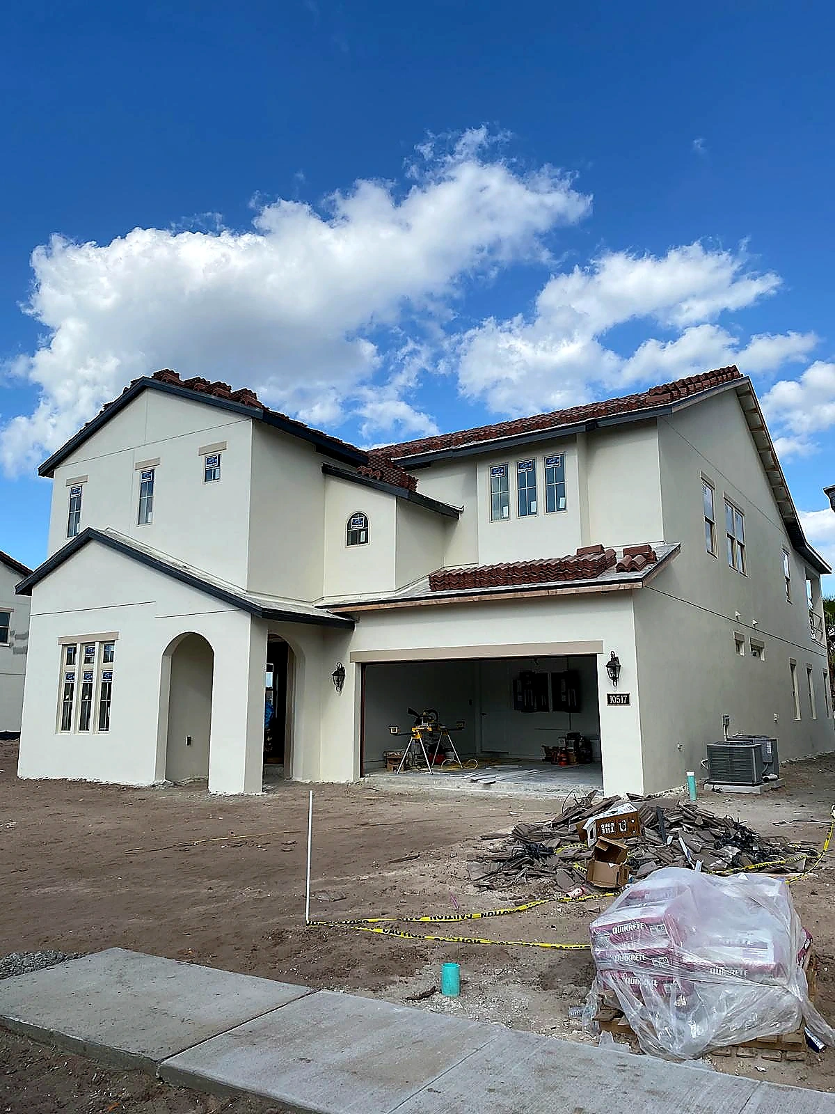 Residential exterior work in progress at a two-story home